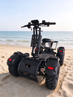 Black YMT ATV20 electric all-terrain vehicle on a beach